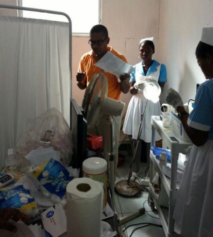 I-TECH's Dr. Jean Guy Honoré and nurses assess supplies.