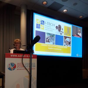 Ann Downer gives a presentation at the AIDS 2018 Conference.